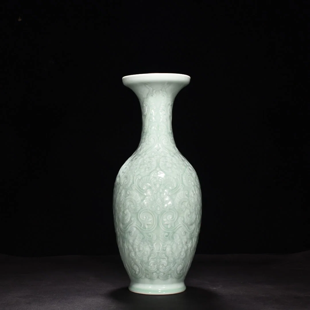 Qing Dynasty Qianlong pink celadon glaze carved lotus dish vase