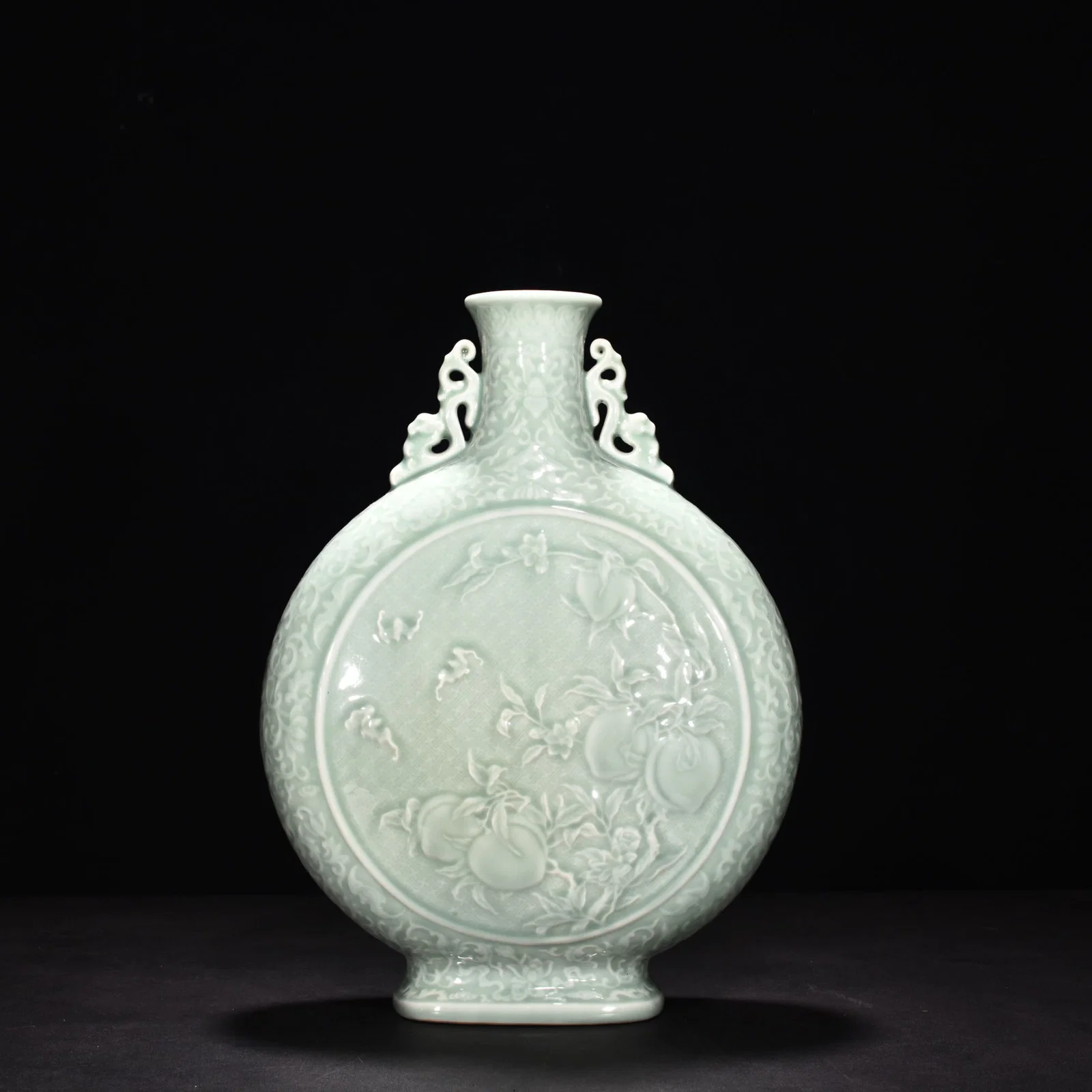 Qing Dynasty Qianlong pink celadon glaze carved peaches flat vase