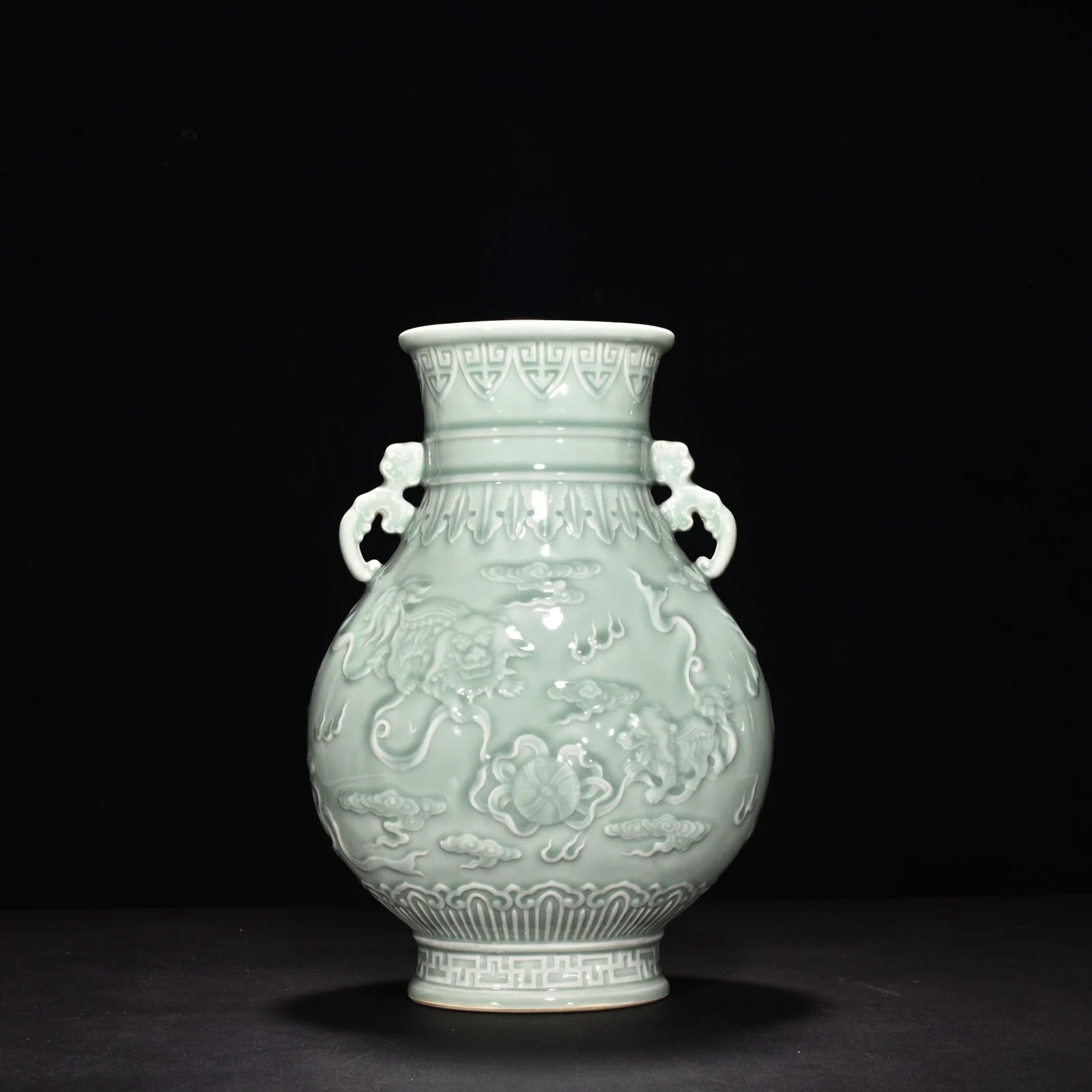 Qing Dynasty Qianlong pink celadon glaze carving "Everything goes well" with two ears vase