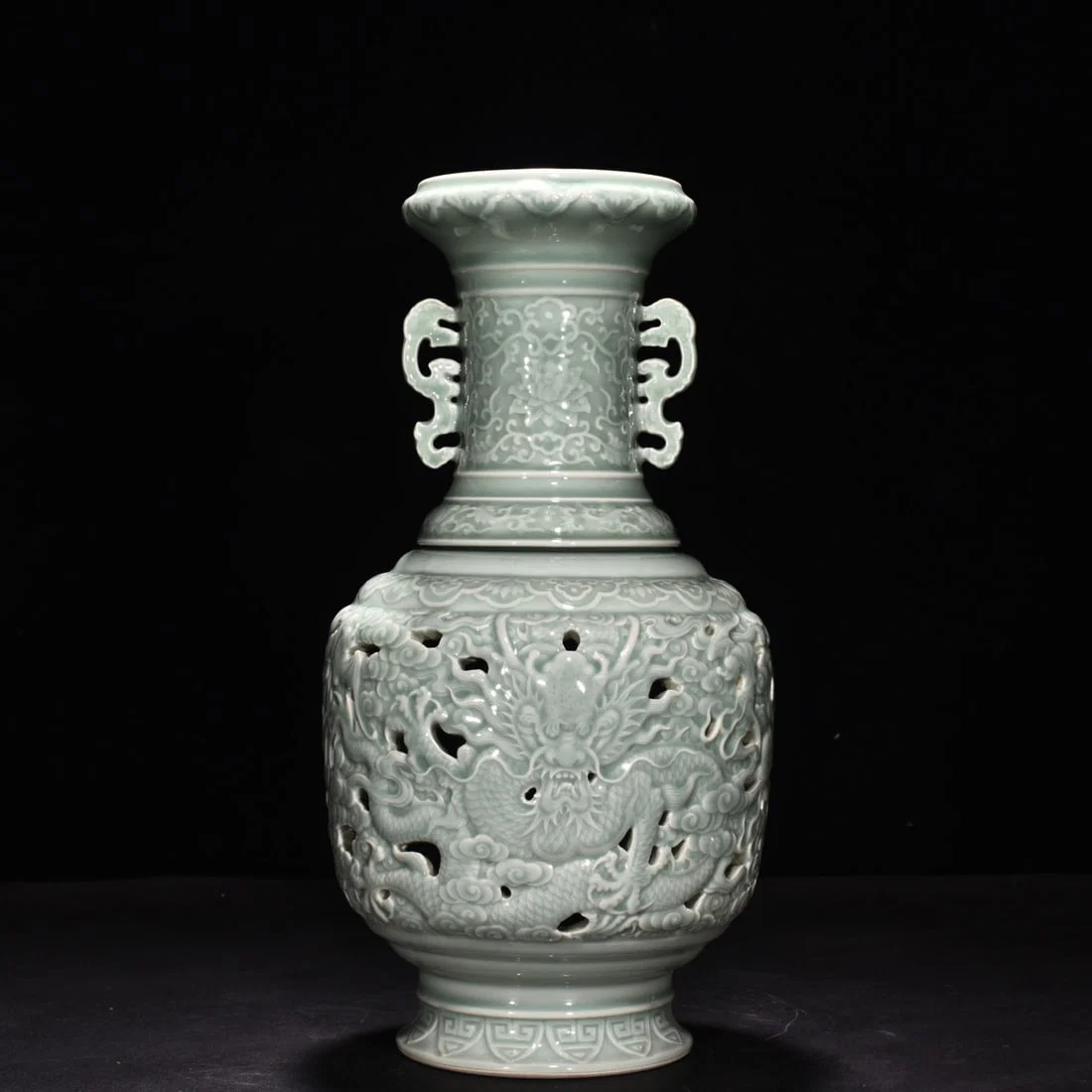 Qing Dynasty Qianlong pink celadon glaze hollow cloud and dragon revolving bottle