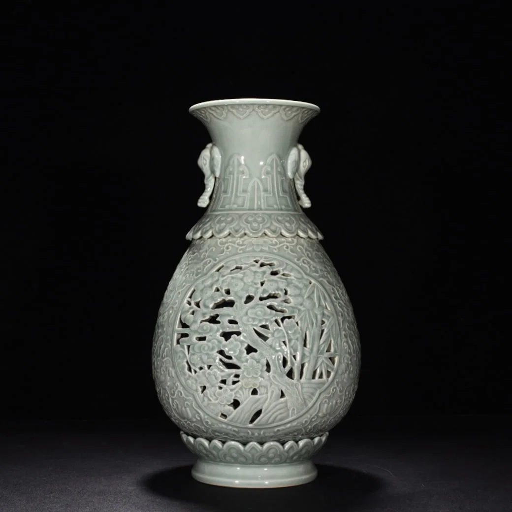 Qing Dynasty Qianlong pink celadon glaze hollow pine bamboo and plum revolving vase
