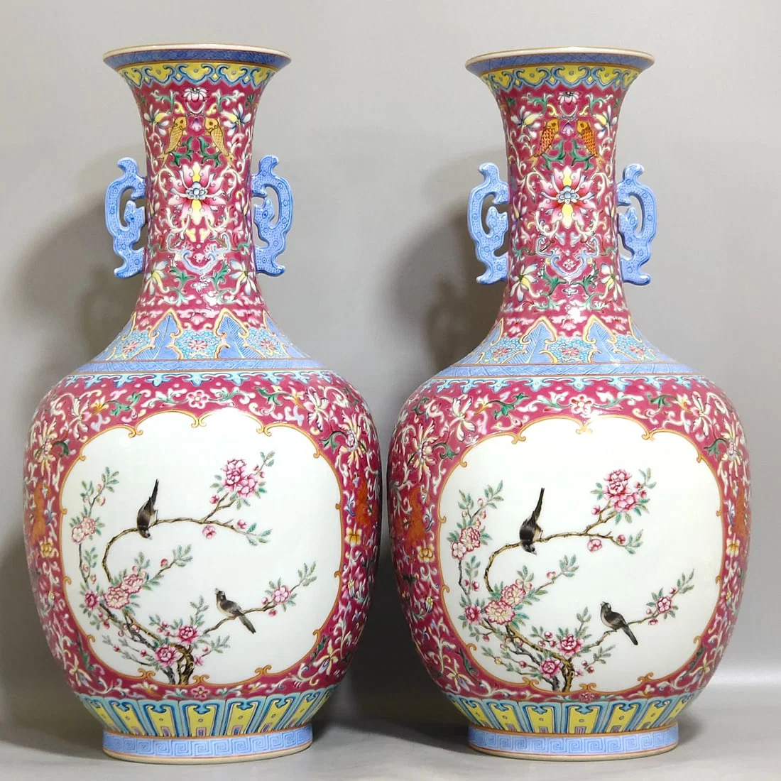 Qing Dynasty Qianlong rouge ground windowed flower and bird amphorae