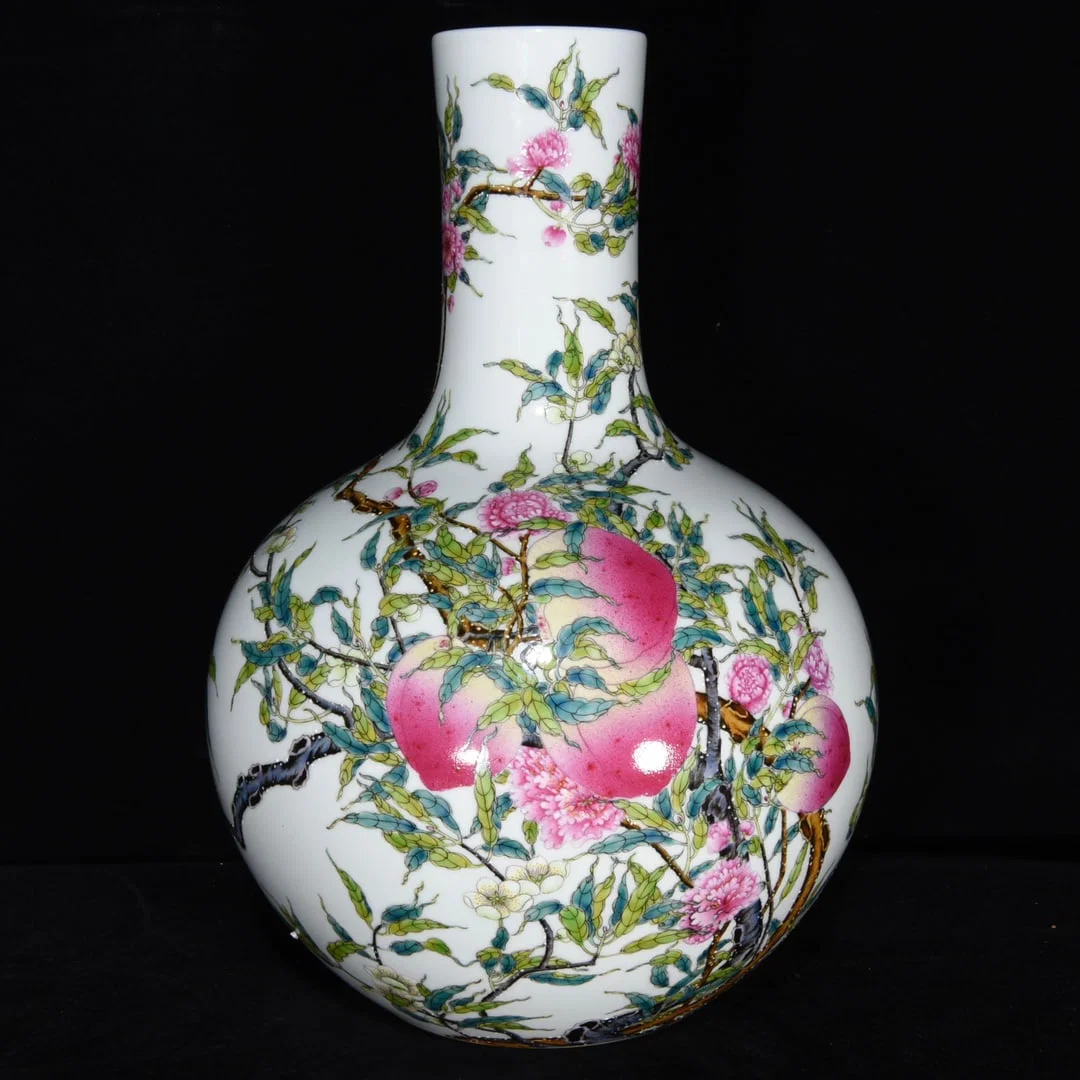 Qing Dynasty Yongzheng famille rose eight-peach celestial sphere vase