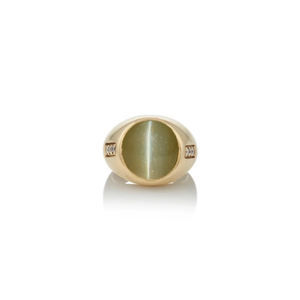 SHREVE, CRUMP, & LOW CO.: A 14K GOLD, CAT'S EYE CHRYSOBERYL, AND DIAMOND RING