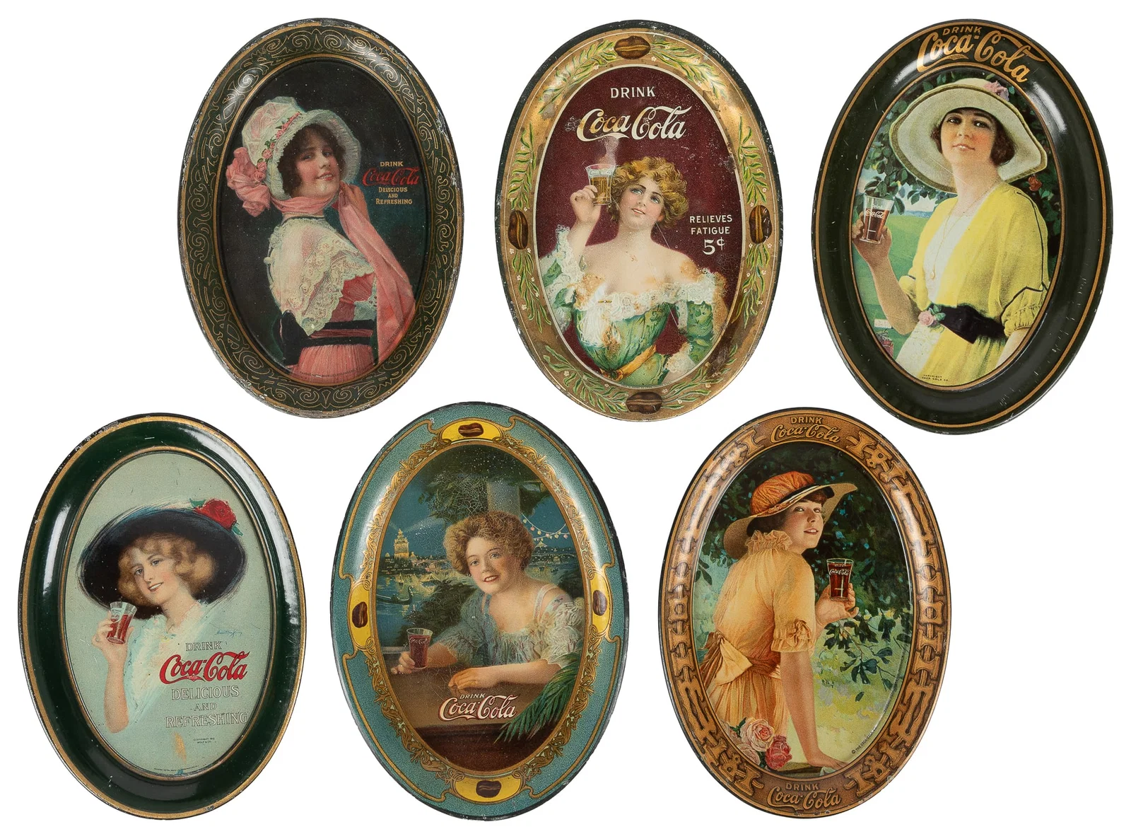 Six Coca-Cola advertising tip trays.