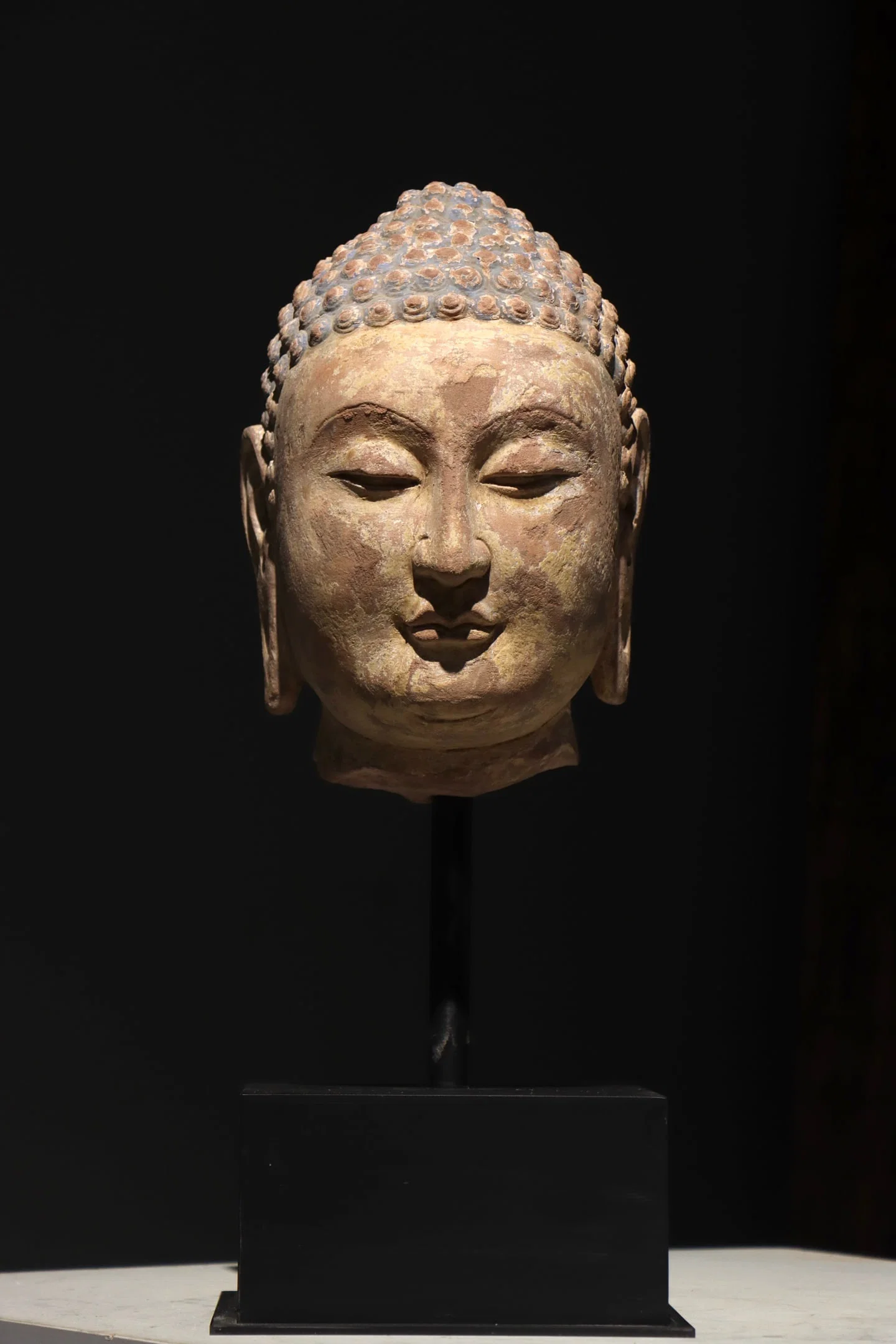 TANG DYNASTY RED SANDSTONE BUDDHA HEADS