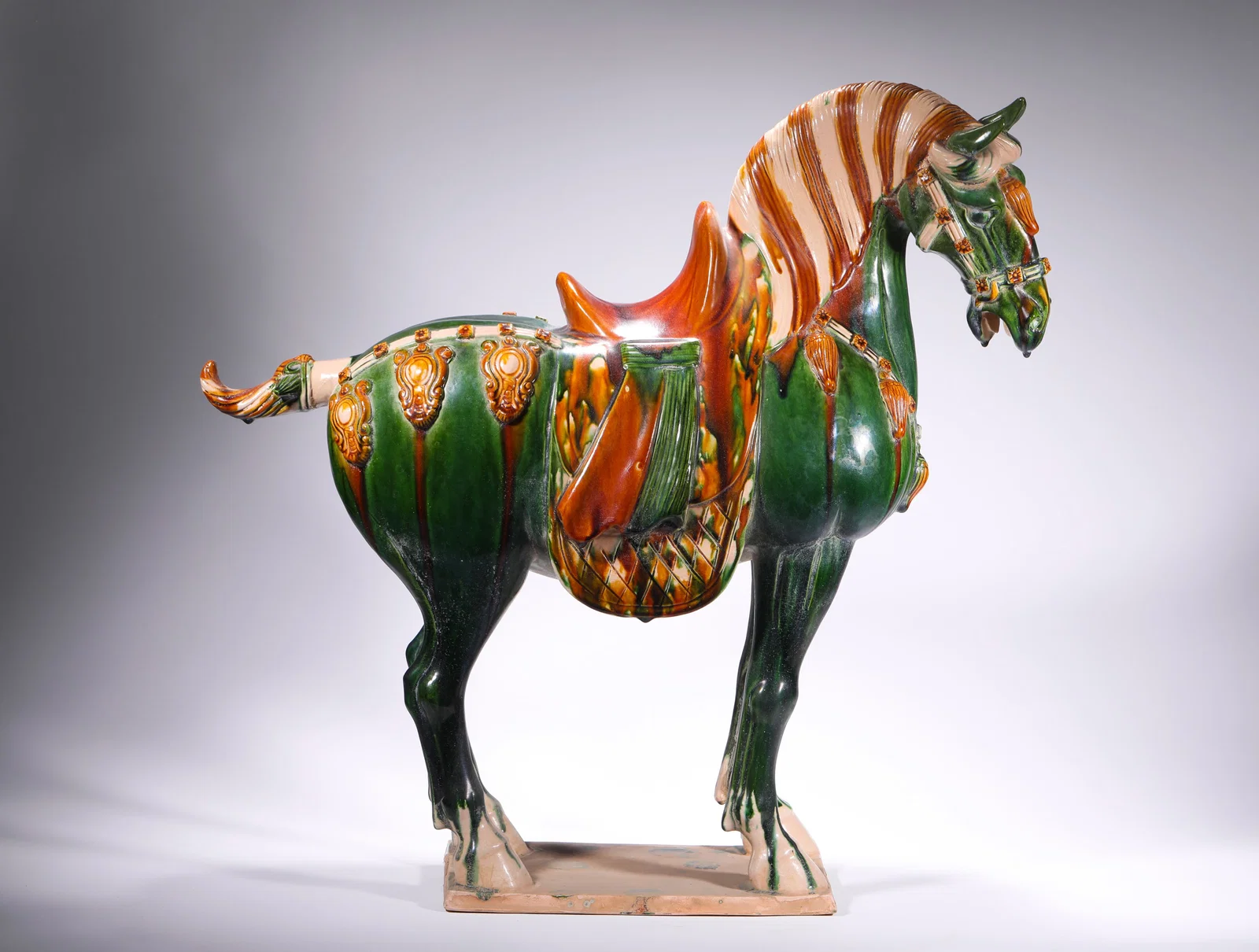 TANG SANCAI GREEN GLAZED HORSE AND SADDLE FIGURINES