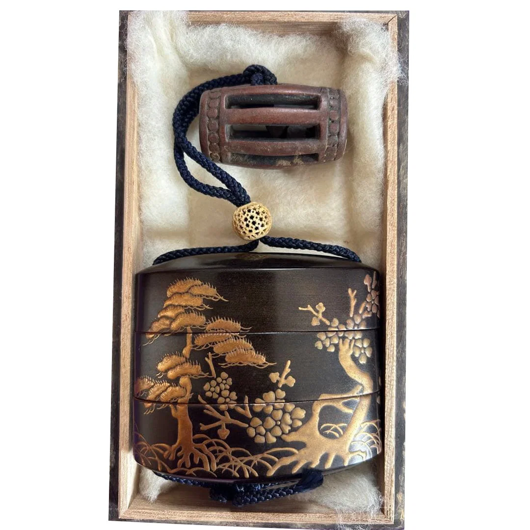 The box is decorated with landscape patterns.