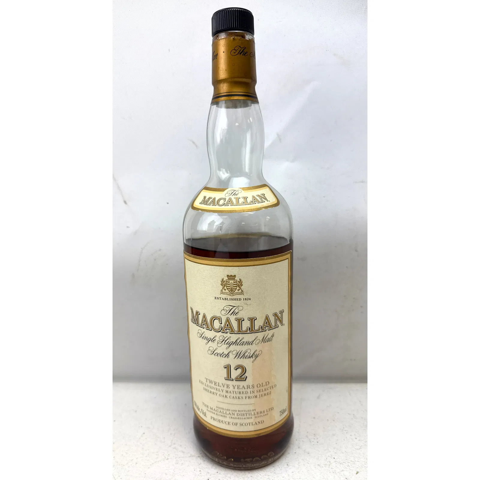 The Macallan 12 Year Old Single Highland Malt Scotch Whisky. Opened and only partially filled.