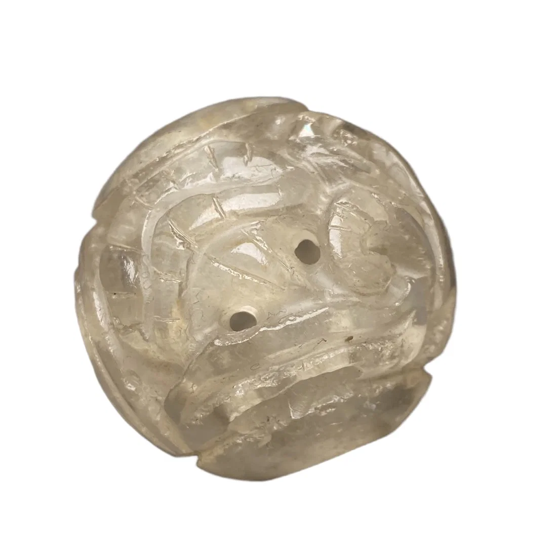 The old crystal is intricately carved with a pine tree and crane design, symbolizing longevity, and