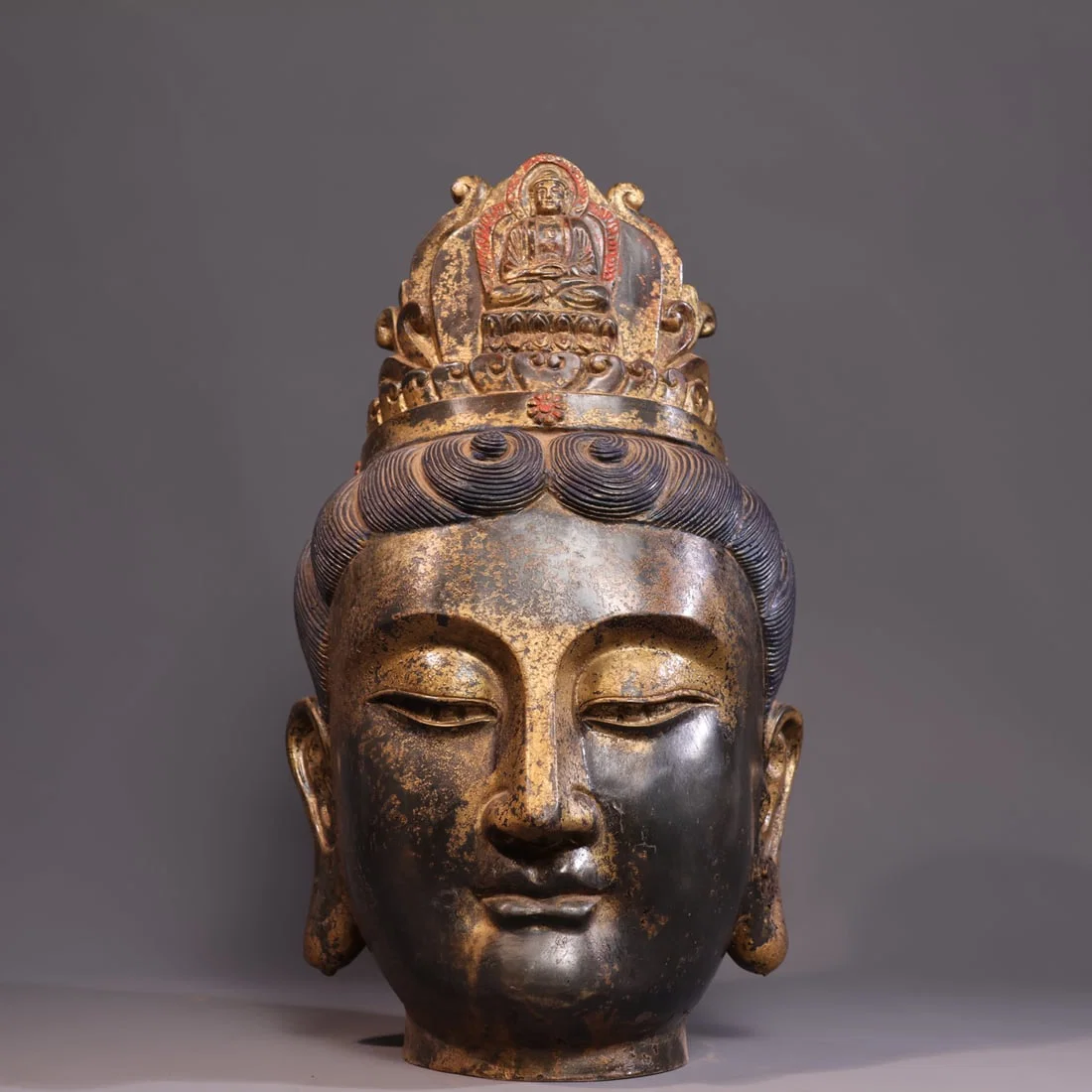 This exquisite pure copper gilded Buddha statue features a Guanyin head with a regular and robust