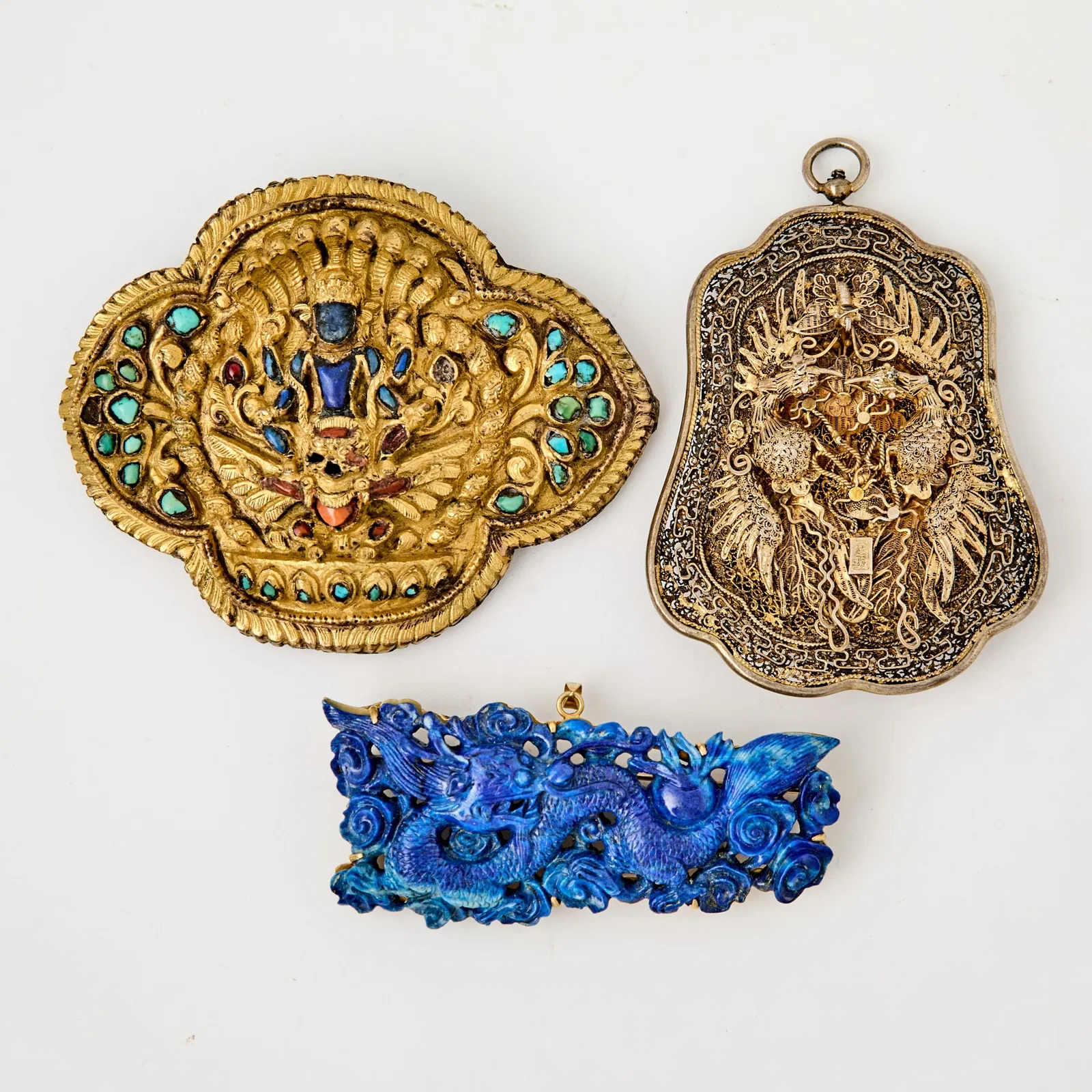 Three Chinese and Tibetan Metal and Hardstone Pendants 19th Century