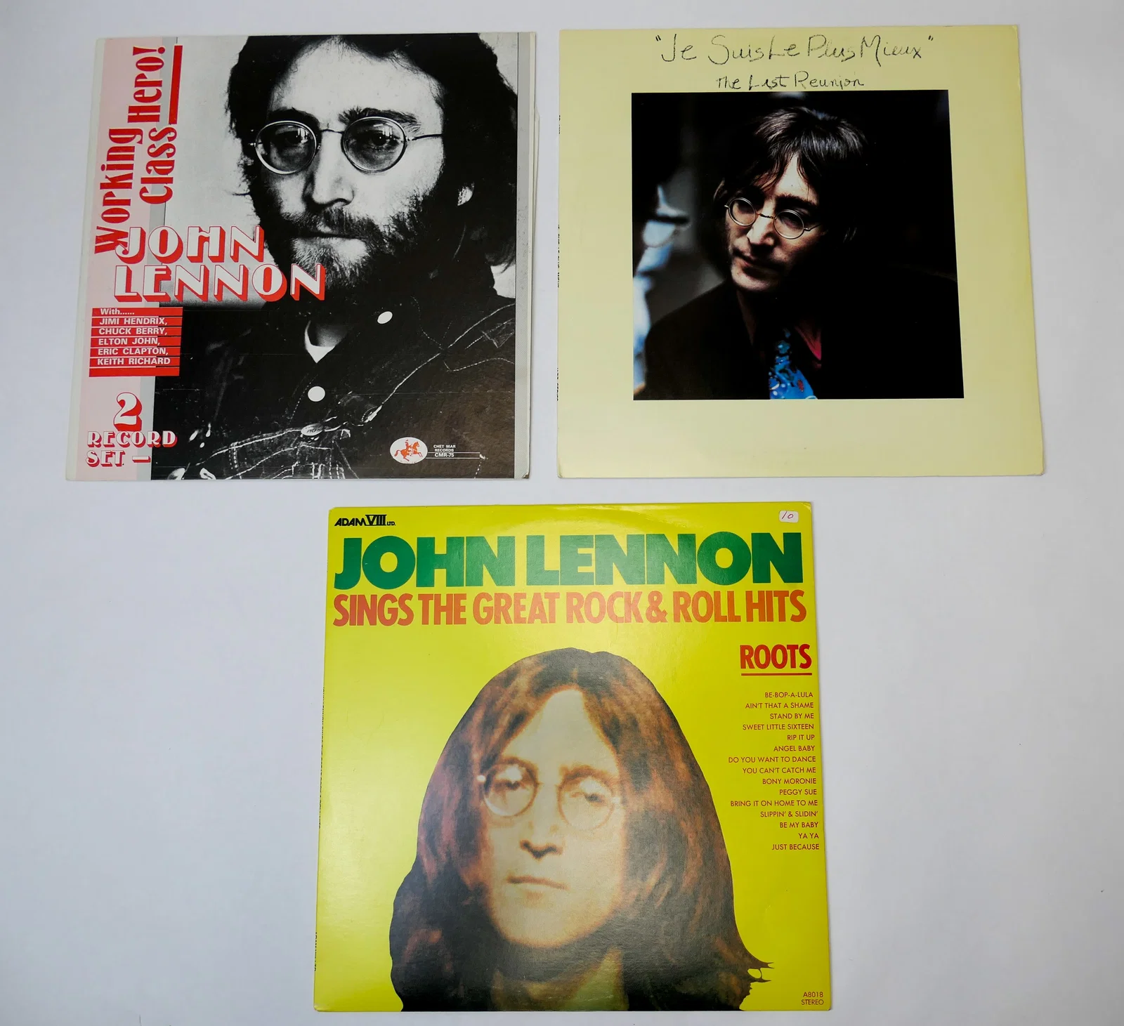 Three John Lennon Records