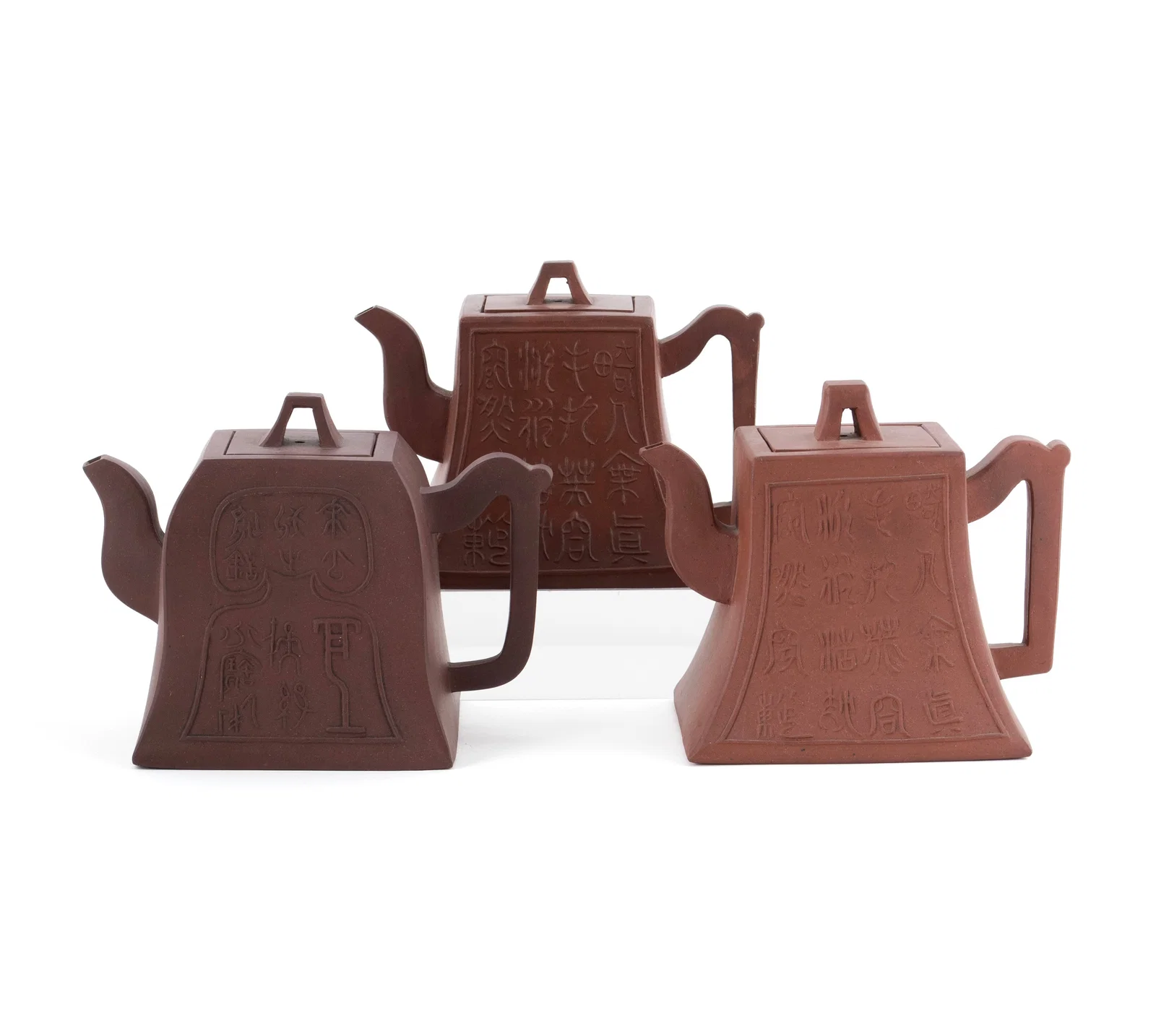 THREE YIXING CALLIGRAPHY TEAPOTS