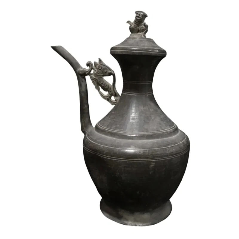 Tin wine pot, with a signature at the bottom.