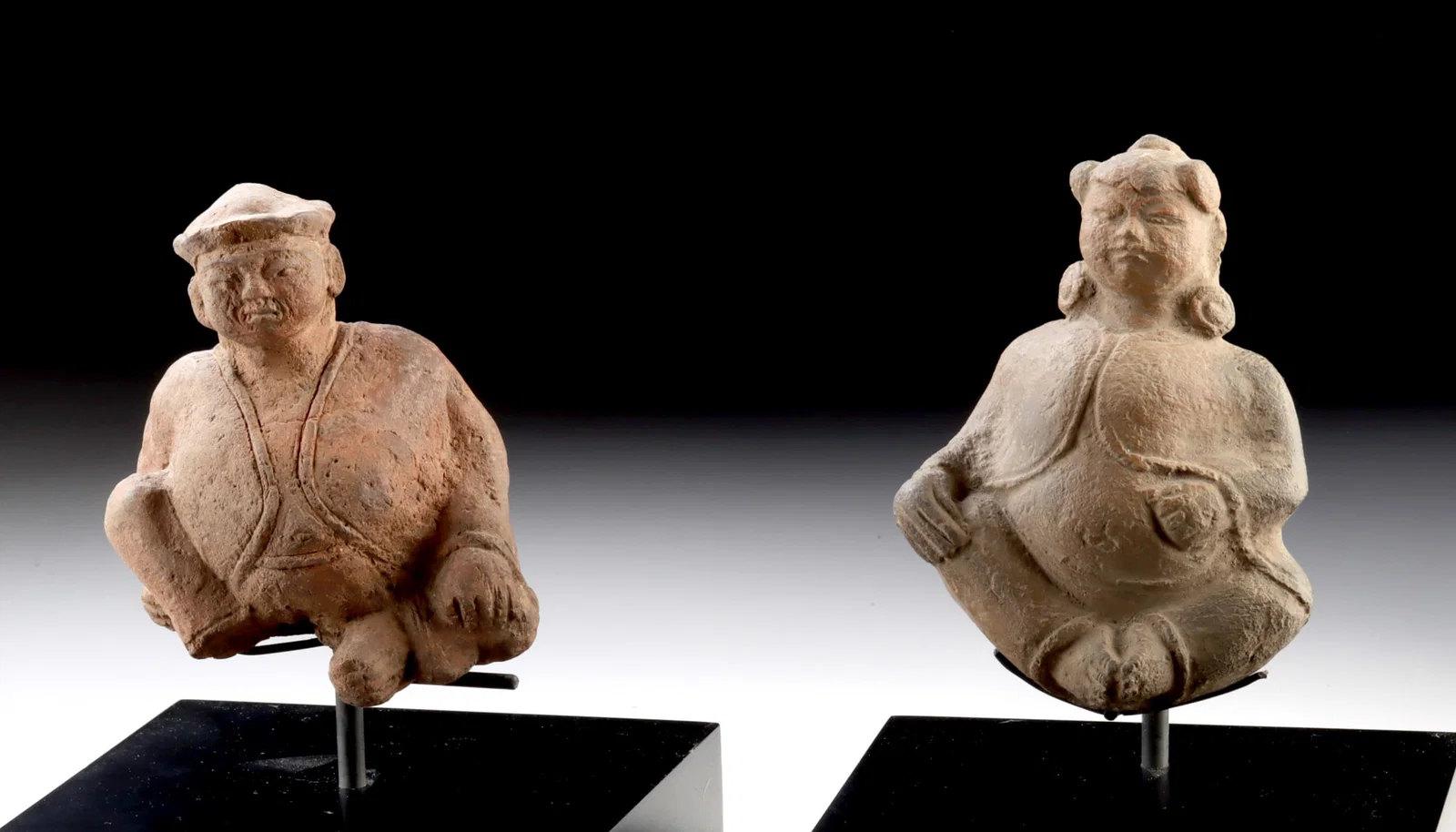 Two Chinese Yuan / Ming Pottery Seated Figures