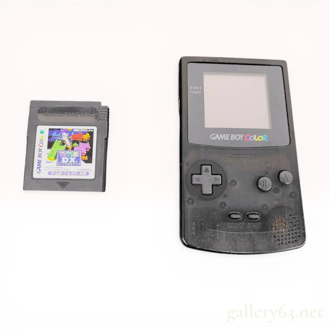 Two Nintendo Gaming Items: Game Boy Color Console and Tetris DX Cartridge