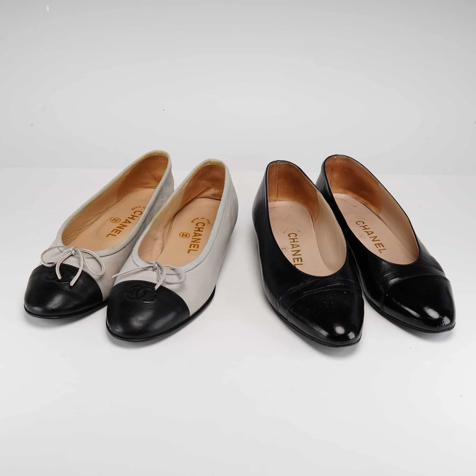 Two Pairs of Chanel Beige and Black Leather Flats