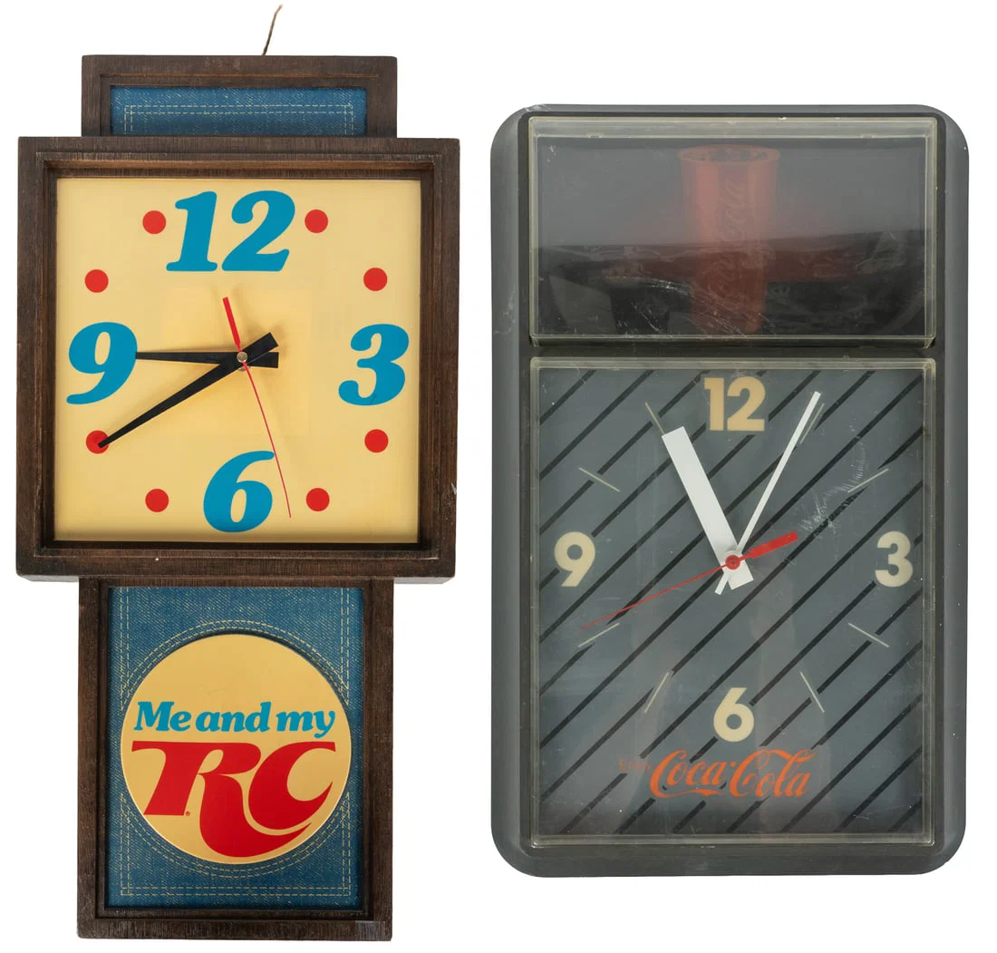 Two soda advertising wall clocks.