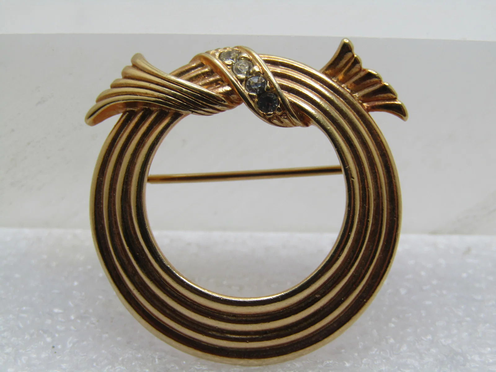 Vintage Circle Brooch with Rhinestone Looped Bow on Top, Signed Avon, 1970's