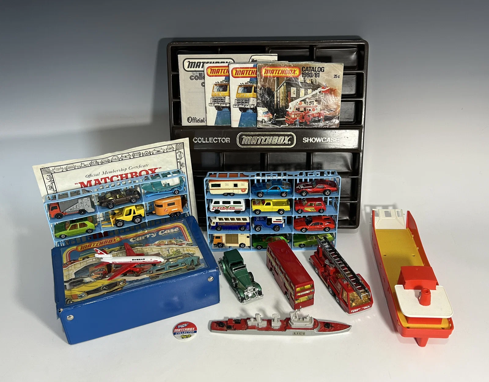 VINTAGE MATCHBOX COLLECTOR'S LOT WITH CARRY CASES, SHIPS, AND DIE-CAST VEHICLES