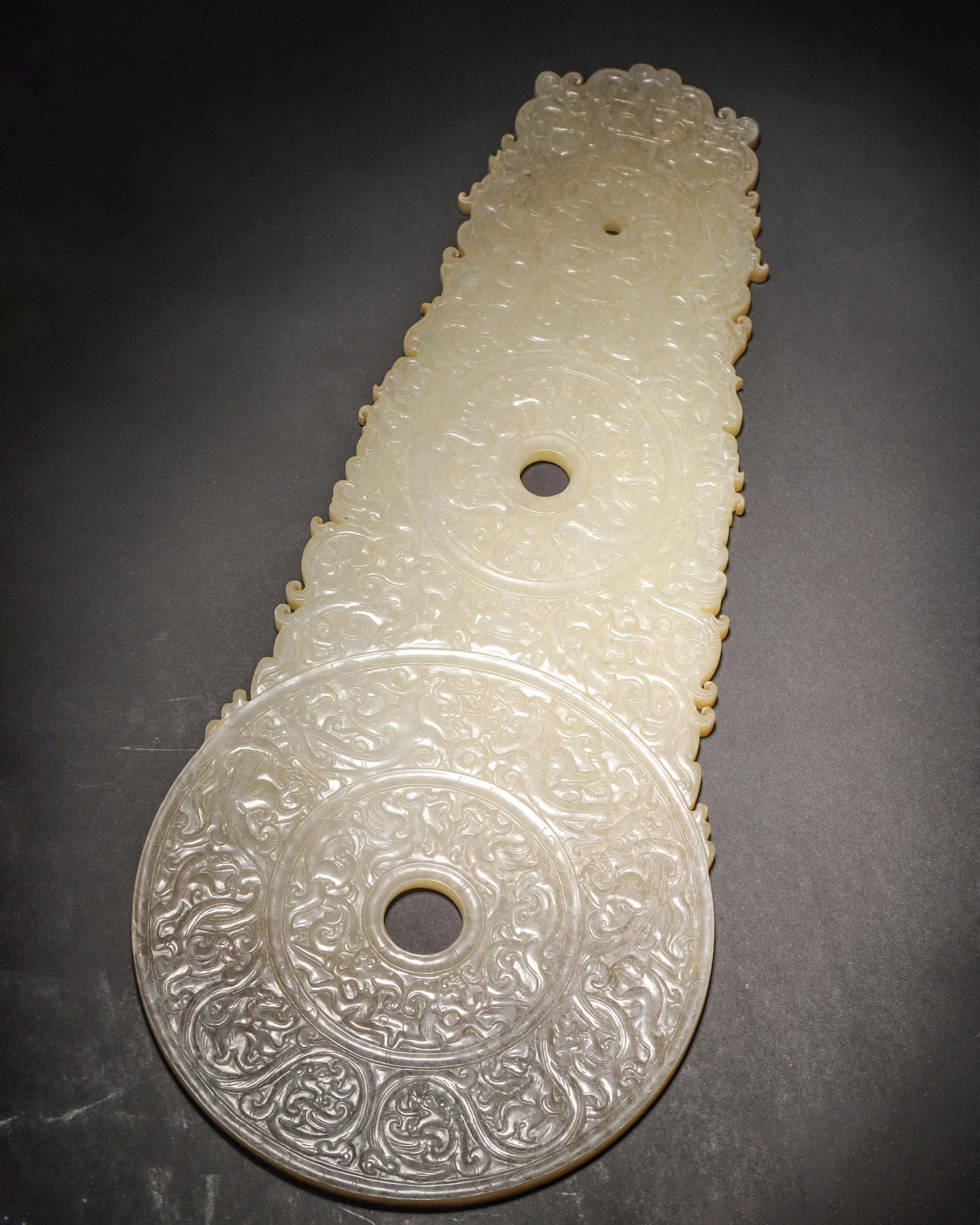 WESTERN HAN DYNASTY HETIAN JADE BI WITH HIGH-RELIEF DRAGON & PHOENIX MOTIFS (TRIPLE-LINKED)