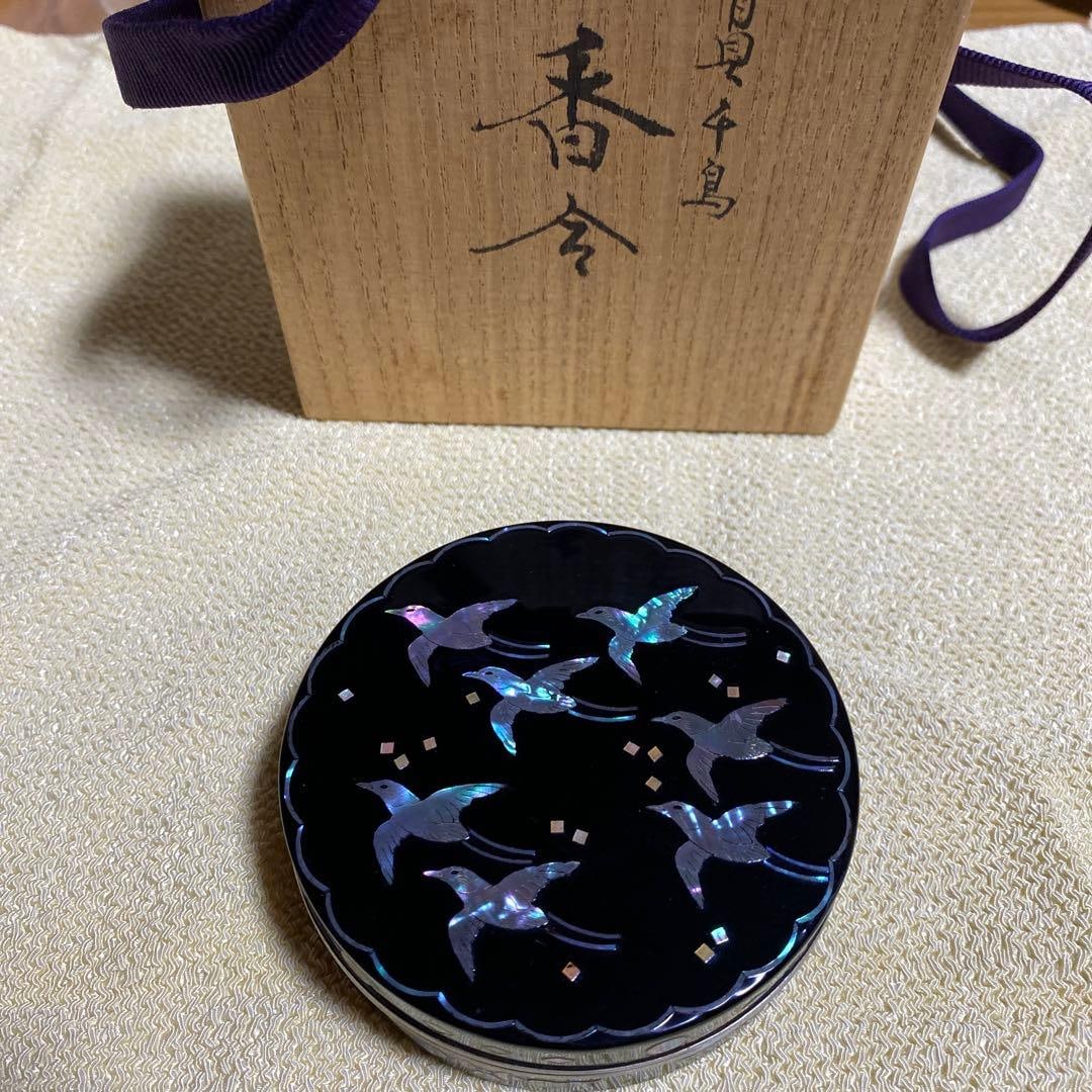 Wooden incense box, tin-edged, gold interior, mother-of-pearl pattern; brand new, unused.