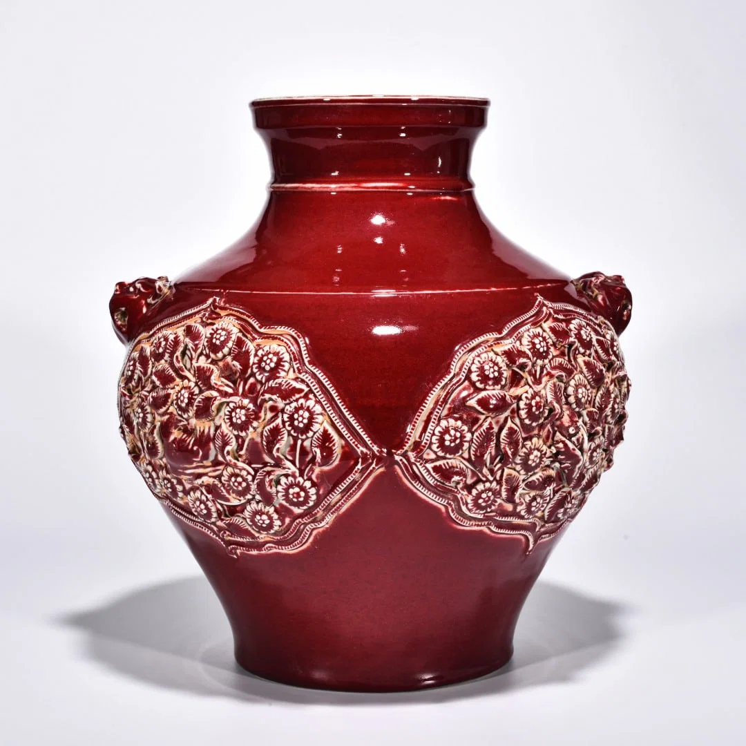 Yuan Dynasty red glazed mandarin duck and flower porcelain animal ear jar