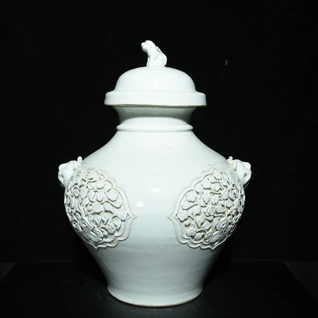 Yuan Dynasty sweet white glaze pinch flower animal head lid jar